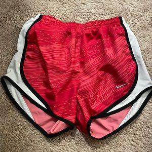 red Nike shorts